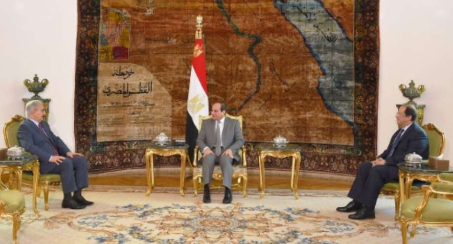 Egyptian President Abdel Fattah al-Sisi C met with Libyan commander Khalifa Haftar L in Cairo on Thursday.  By HO EGYPTIAN PRESIDENCYAFP