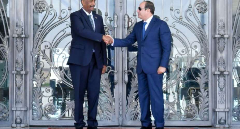 Egyptian President Abdel Fattah al-Sisi R receives Sudanese General Abdel Fattah al-Burhan in El Alamein.  By - Egyptian PresidencyAFP