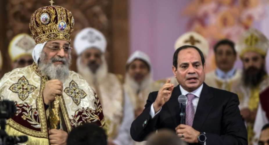 Egyptian President Abdel Fattah al-Sisi speaks during a Christmas Eve mass at the Nativity of Christ Cathedral n January 6, 2018.  By KHALED DESOUKI AFP