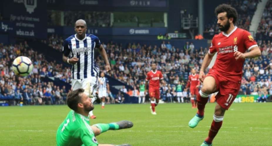 Egyptian star Mohamed Salah cool chip over West Brom goalkeeper Ben Foster was his 31st goal for Liverpool this season..  By Lindsey PARNABY AFPFile