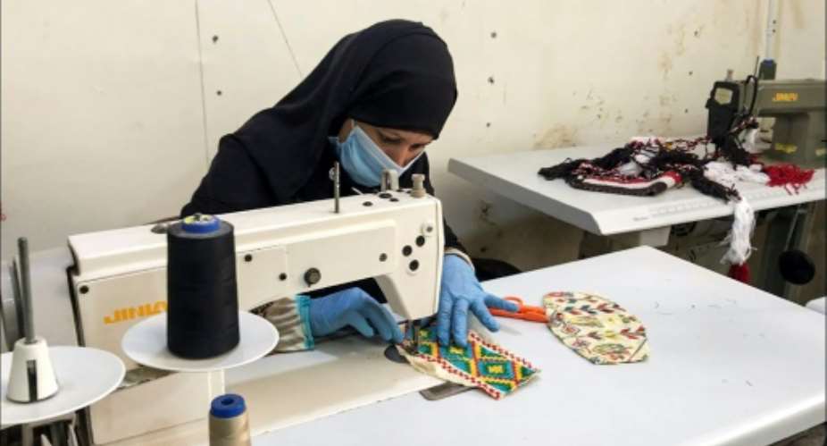 Egypt's Bedouin textile tradition of tatriz -- weaving and beading rich geometric and abstract designs on garments, cushions and purses -- has been passed down from generation to generation.  By - El Fayrouz For Environmental  Social  Economic Services AssociationAFP