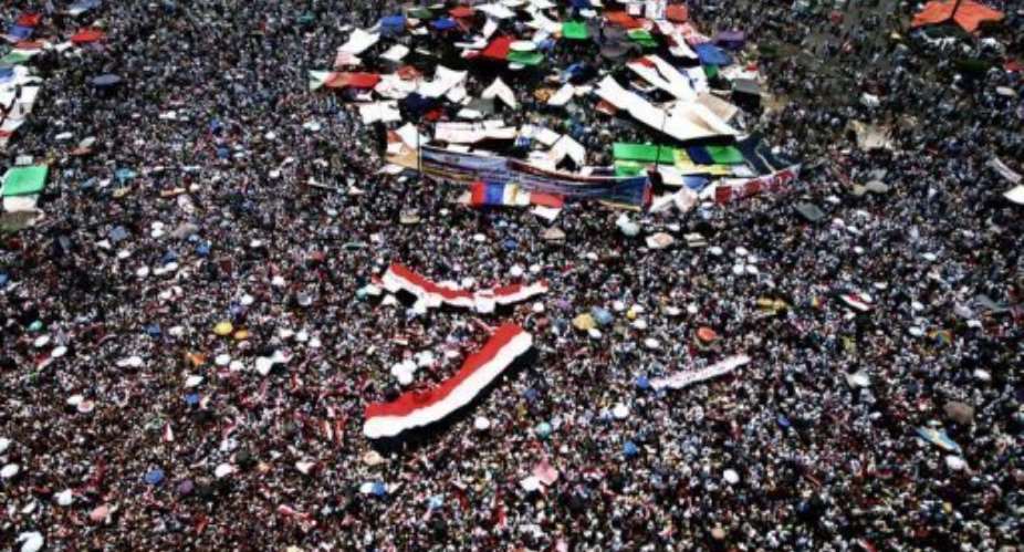 Supporters of the Muslim Brotherhood's presidential candidate pack Cairo's landmark Tahrir Square Friday.  By Marwan Naamani AFP