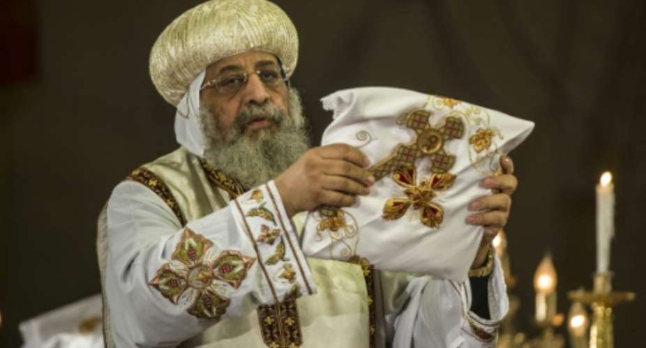 Egypt's Coptic Pope Tawadros II leads a mass in Cairo to honour the memory of Christians killed by Islamic State group militants in Libya, on February 17, 2015.  By Khaled Desouki AFPFile