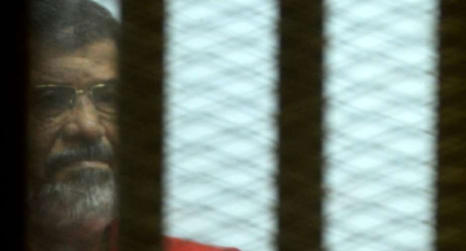 Egypt's former president Mohamed Morsi, pictured in June at a court in Cairo.  By Mohamed El-Shahed AFPFile