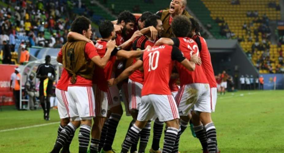 Egypt's players celebrate a goal on January 21, 2017.  By Justin TALLIS AFP