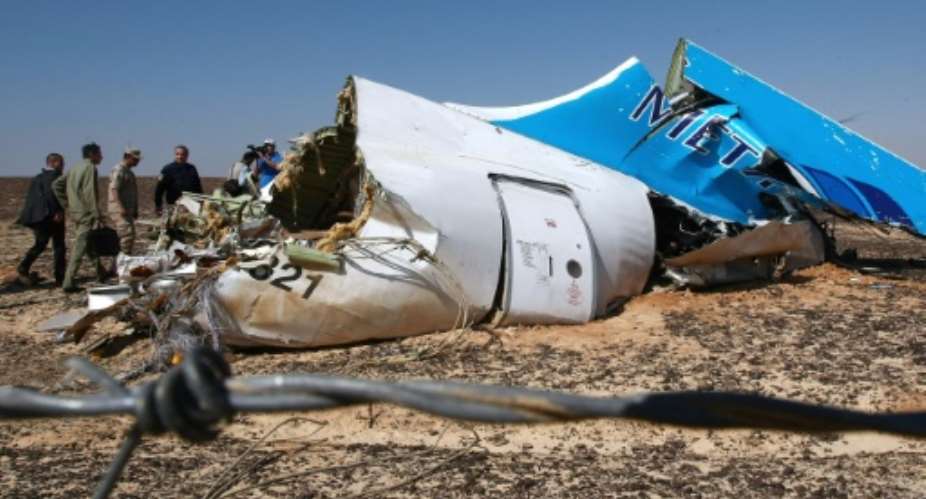 Russian officials visit the crash site of a A321 Russian airliner in Wadi al-Zolomat, a mountainous area of Egypt's Sinai Peninsula on November 1, 2015.  By Maxim Grigoryev Russia Emergency MinistryAFPFile