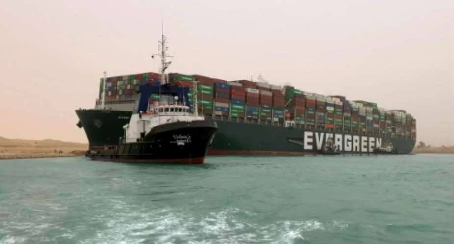 Egypt's Suez Canal Authority said it was working to refloat the MV Ever Given.  By - (Suez CANAL/AFP)
