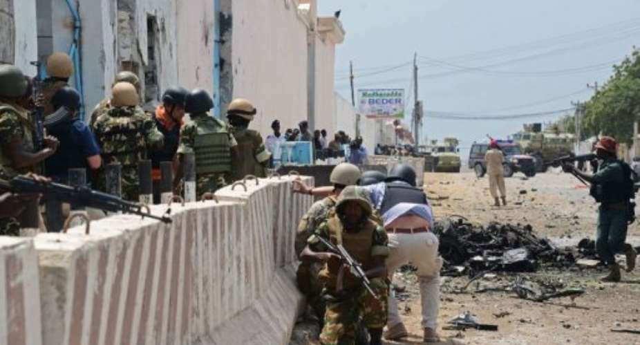 African Uinion force in Somalia (AMISOM) soldiers respond on June 19, 2013 to an attack on the UN compound in Mogadishu.  By Mohamed Abdiwahab (AFP)