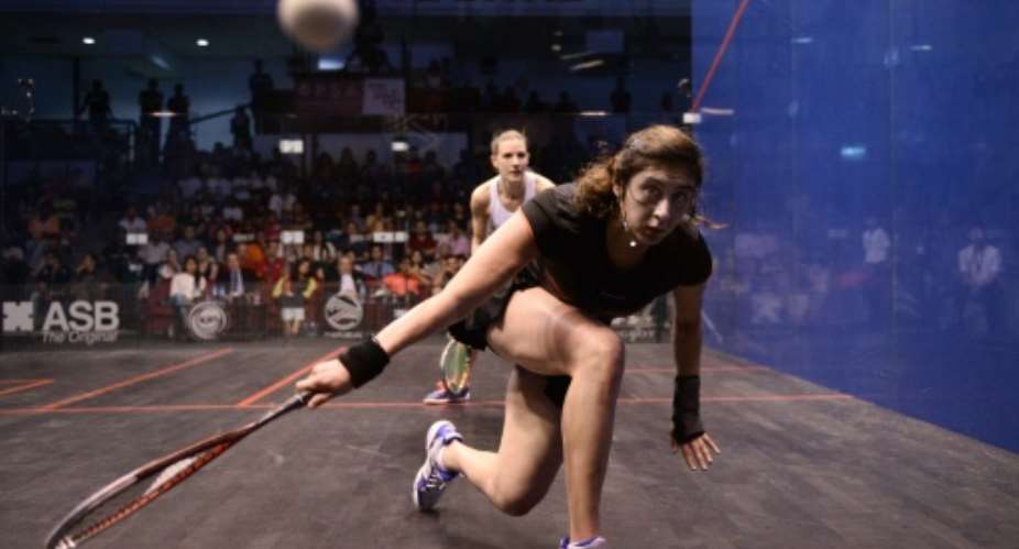 Nour El Sherbini of Egypt plays a forehand against Laura Massaro of England during the final of the PSA Women's World Championships in Bukit Jalil, oustide Kuala Lumpur, on April 30, 2016.  By Mohd Rasfan AFP