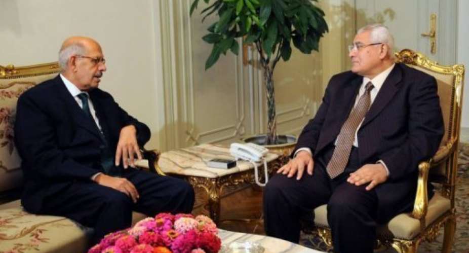 Egypts interim president Adly Mansour (R) meets with newly appointed Prime Minister Mohamed ElBaradei in Cairo.  By  (Egyptian Presidency/AFP)