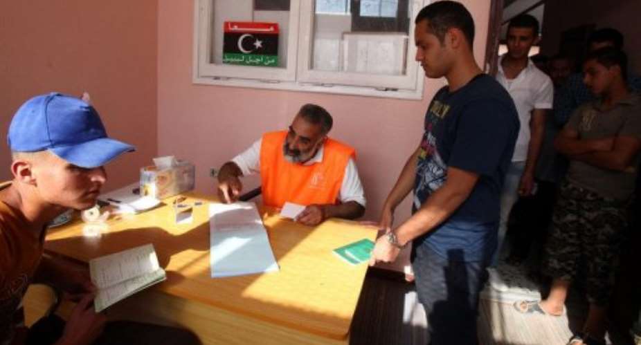 Libyan students register to vote in the upcoming legislative elections in Tripoli.  By Mahmud Turkia (AFP/File)