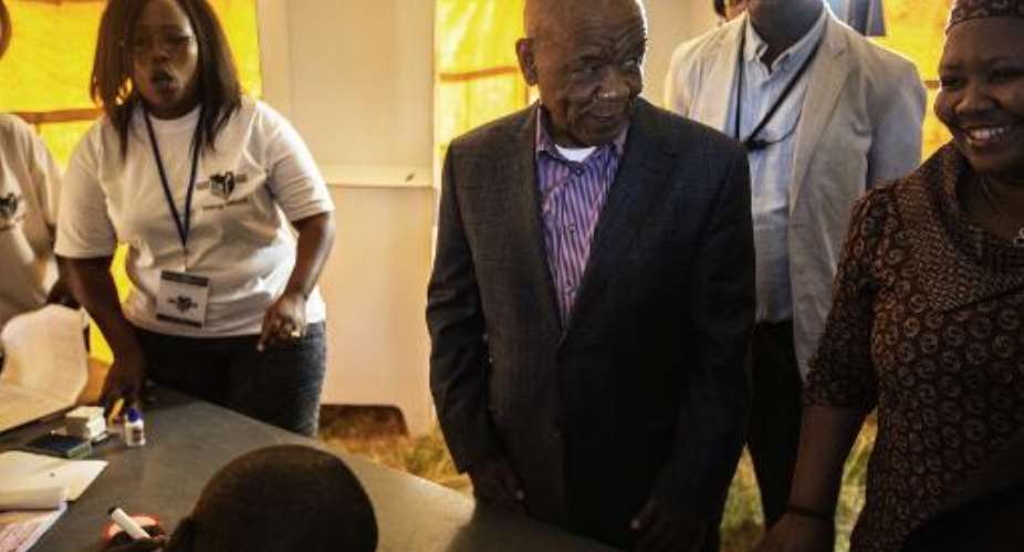 Lesotho Prime Minister Tom Thabane, pictured here at a polling station on February 28, 2015, has taken an early lead in the snap election with a quarter of the votes tallied so far.  By Gianluigi Guercia AFP