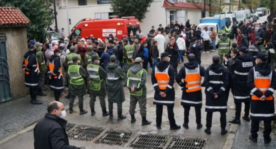 Emergency services gather at the site of illegal underground textile workshop that flooded after heavy rain fall in Morocco's city of Tangiers on February 8, 2021.  By - AFPFile