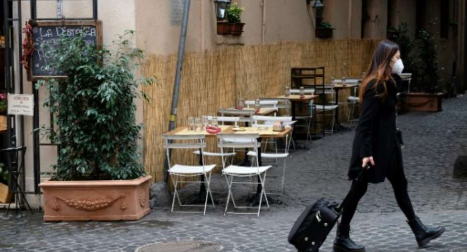 Empty cafes in Italy as large parts of the country return to lockdown.  By ANDREAS SOLARO (AFP)