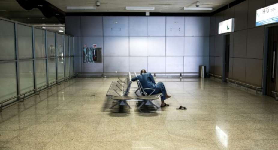 Empty: The arrivals gate Dakar's Blaise Diagne International Airport. Travel bans and a nightly curfew have had a huge economic impact in Senegal.  By JOHN WESSELS AFP
