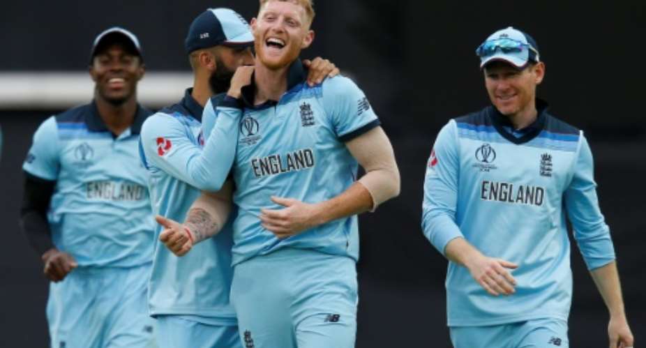 England's Ben Stokes centre celebrates with teammates after taking South Africa's last wicket as the home side won their World Cup opener.  By Ian KINGTON AFP