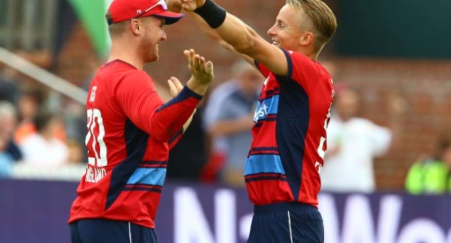 England's Tom Curran R celebrates with England's Jason Roy after taking the wicket of South Africa's Chris Morris during the second international Twenty20 cricket match June 23, 2017.  By Geoff CADDICK AFP