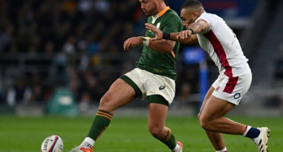 England's wing Joe Marchant R vies with South Africa's  fly-half Handre Pollard during the Autumn International friendly rugby union match between England and South Africa at Twickenham Stadium, south-west London, on November 20, 2021..  By Glyn KIRK AFPFile