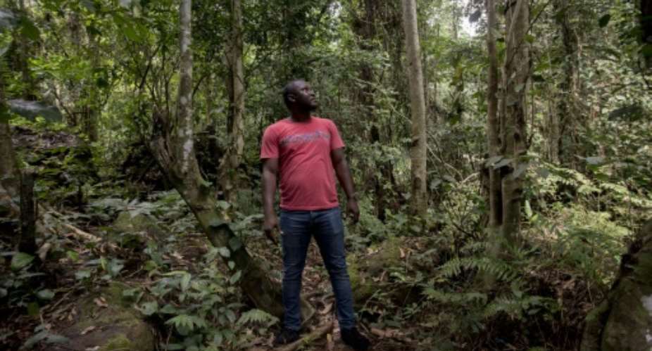 Environmentalists and activists like Daryl E. Bosu C, fear how bauxite development will damage the Kyebi forest. Locals, though, are swayed by the prospects of jobs and money.  By CRISTINA ALDEHUELA AFP