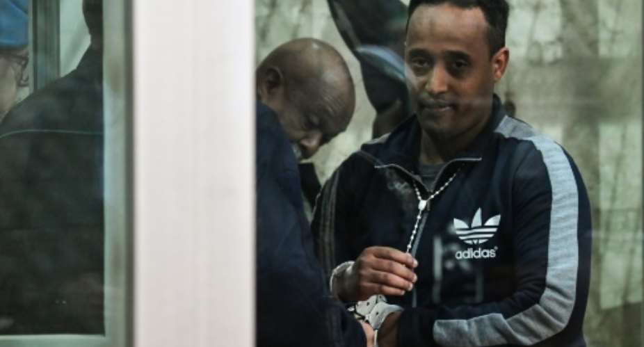 Eritrean national Medhanie Yehdego Mered was cleared of being the General of one of the world's largest migrant trafficking networks.  By Andreas SOLARO AFPFile