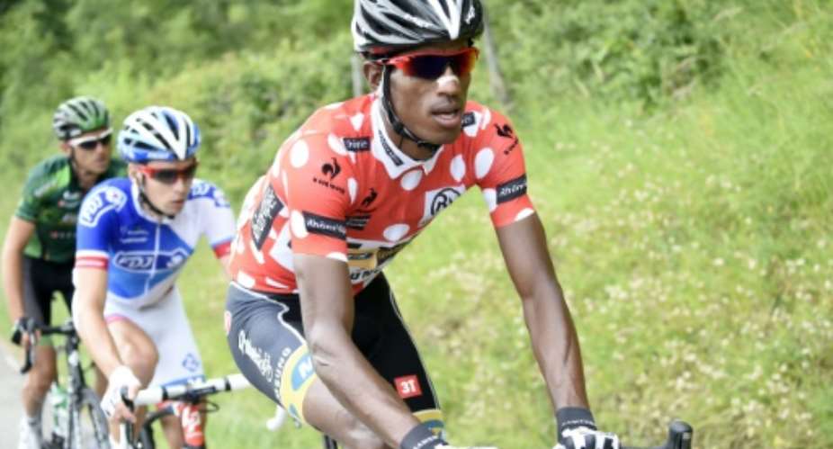 Eritrea's Daniel Teklehaimanot R, wearing the best climber's polka dot jersey, seen riding during the Dauphine Criterium cycling race, between Le Bourget-du-Lac and Villars-les-Dombes, on June 8, 2015.  By Eric Feferberg AFPFile