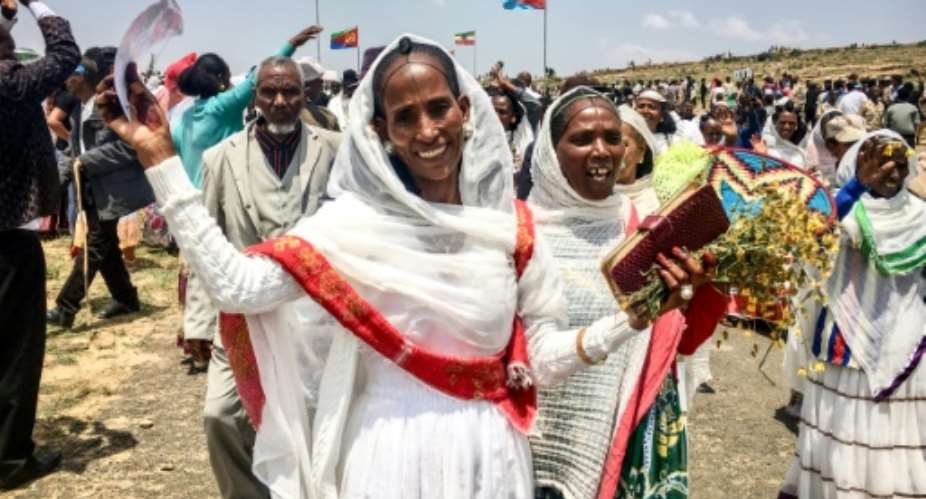Eritrean women expressing their joy as two land border crossings between Ethiopia and Eritrea were reopened for the first time in 20 years on September 11, 2018.  By Stringer AFPFile