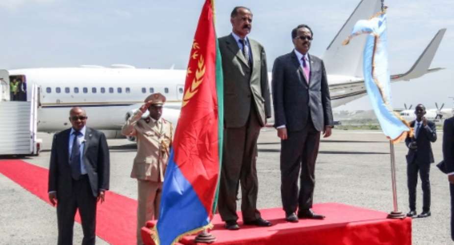 Eritrea's President Isaias Afwerki L and Somalia's President Mohamed Abdullahi Farmajo reviewed an honour guard after the Eritrean leader arrived in Mogadishu to firm up bilateral ties.  By Mohamed ABDIWAHAB AFP