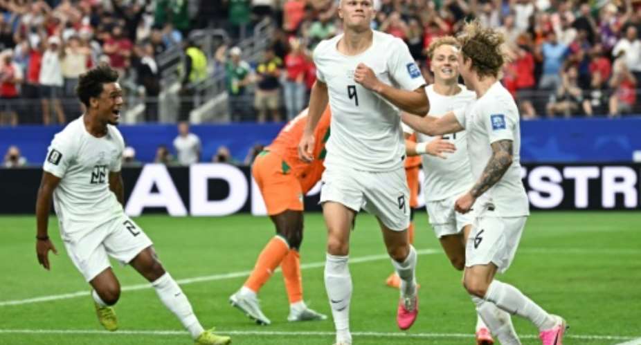 Erling Haaland is mobbed by his teammates after scoring Norways winning goal against the Ivory Coast.  By Paul ELLIS (AFP)