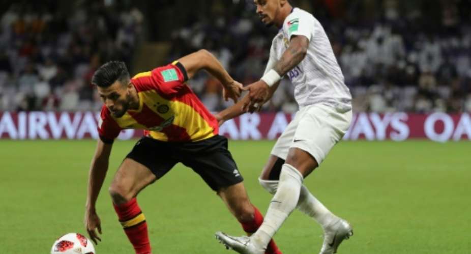 Esperance and Tunisia star Anice Badri L in action against Al Ain of the UAE during the 2018 Club World Cup. His stoppage-time goal salvaged a draw for the African club champions away to Horoya in Guinea Friday.  By Karim Sahib AFP