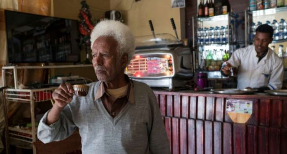 Ethiopian hotel owner Taeme Lemlem, 75, sips a coffee at his hotel which was once destroyed during the war between Ethiopia and Eritrea.  By Maheder HAILESELASSIE TADESE AFPFile
