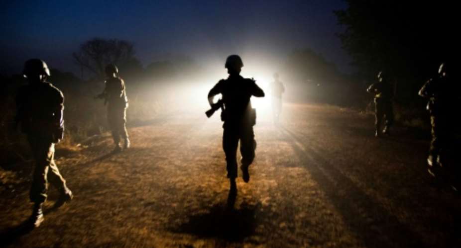 Ethiopian peacekeepers of the United Nations Interim Security Force for Abyei (UNISFA) patrol at night in Abyei town, Abyei state, on December 14, 2016.  By Albert Gonzalez Farran (AFP)