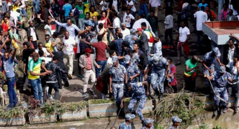 Ethiopian security forces intervene after a blast killed several people during a rally called by Prime Minister Abiy Ahmed.  By YONAS TADESE AFP