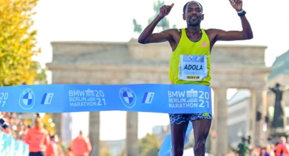 Ethiopia's GuyeAdola wins the men's Berlin Marathon title on Sunday.  By Tobias SCHWARZ AFP