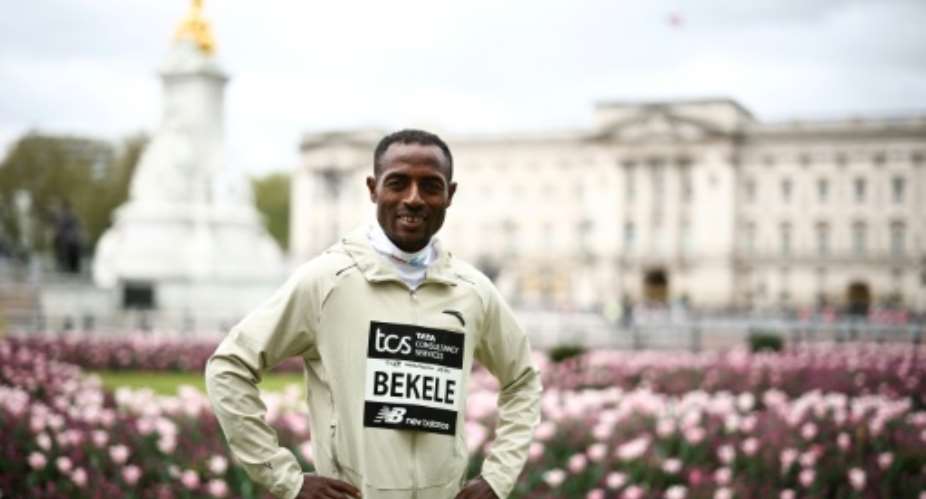 Ethiopia's Kenenisa Bekele poses in front of Buckingham Palace.  By HENRY NICHOLLS AFP