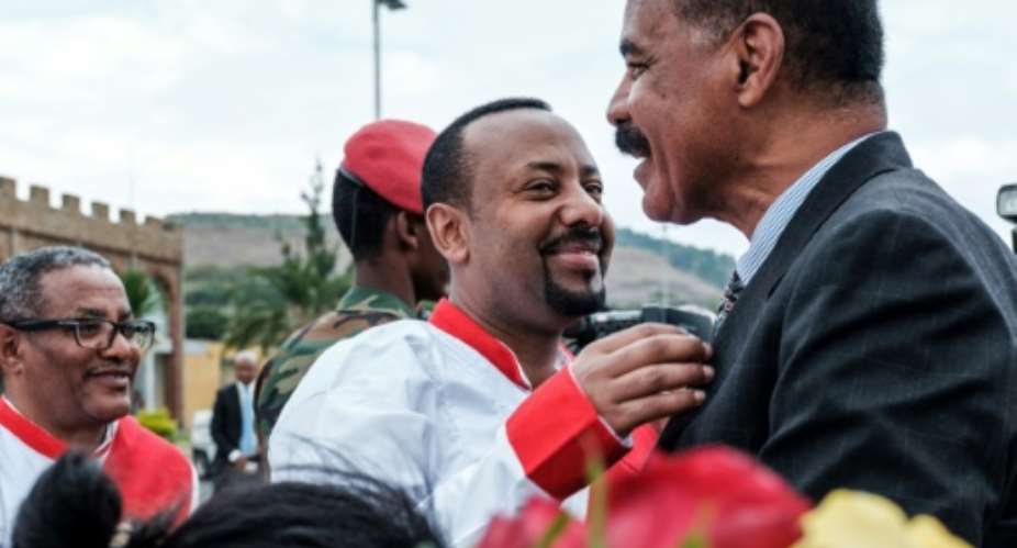Ethiopia's Prime Minister Abiy Ahmed C welcomes Eritrean President Isaias Afwerki at Gondar airport.  By EDUARDO SOTERAS AFP