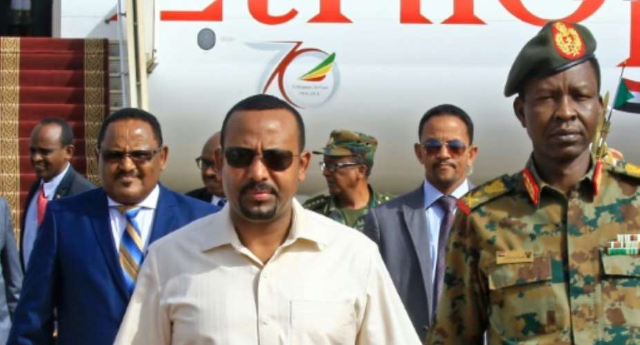 Ethiopia's Prime Minister Abiy Ahmed C-L has been praised for his reforms but activists fear a return to repressive tactics after the June attacks.  By ASHRAF SHAZLY AFPFile