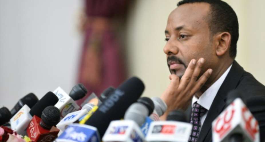 Ethiopia's Prime Minister Abiy Ahmed pictured August 2018, who took office in 2015 and has dealt with many anti-government protests for his agressive reform agenda, has been almost unanimously re-elected.  By Michael Tewelde AFPFile