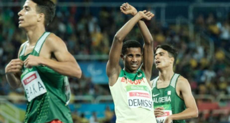 Ethiopias Tamiru Demisse (C) reacts after the final of mens 1500m of the Rio 2016 Paralympic Games on September 11, 2016.  By Yasuyoshi Chiba (AFP)