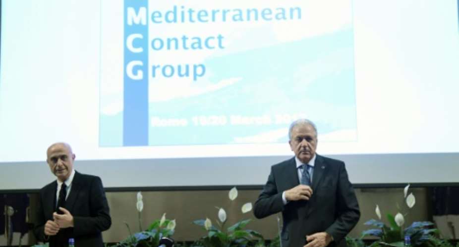 EU Commissioner for Migration, Home Affairs and Citizenship Dimitris Avramopoulos R and  Italy's Interior Minister Marco Minniti look on during the Central Mediterranean contact group meeting on March 20, 2017 in Rome.  By TIZIANA FABI AFP
