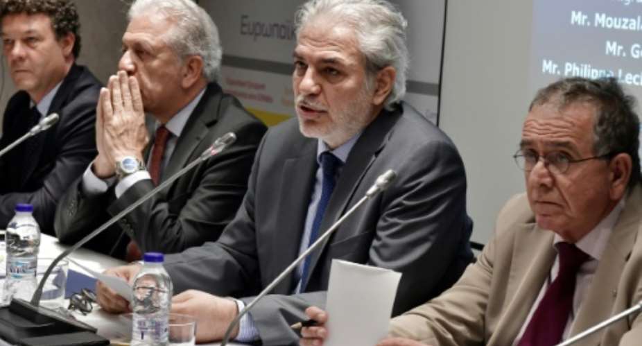 EU commissioner for the Humanitarian Aid and Crisis Managment Christos Stylianides 2ndR, pictured in July 2017, announced an aid package to Sudan, where millions have been displaced for many, many years.  By LOUISA GOULIAMAKI AFPFile