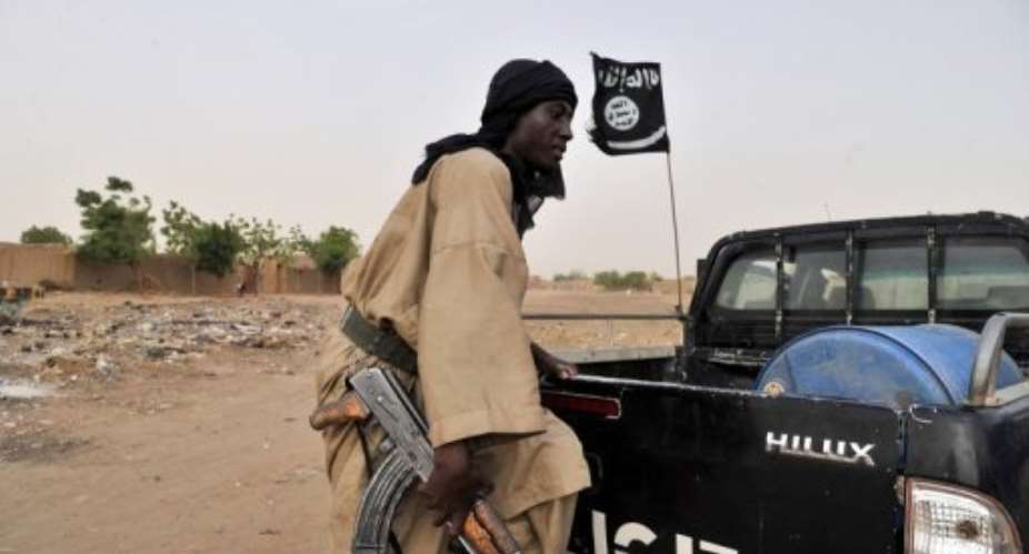 A fighter with Islamist group MUJAO on patrol in Gao, northern Mali, on July 16.  By Issouf Sanogo AFPFile