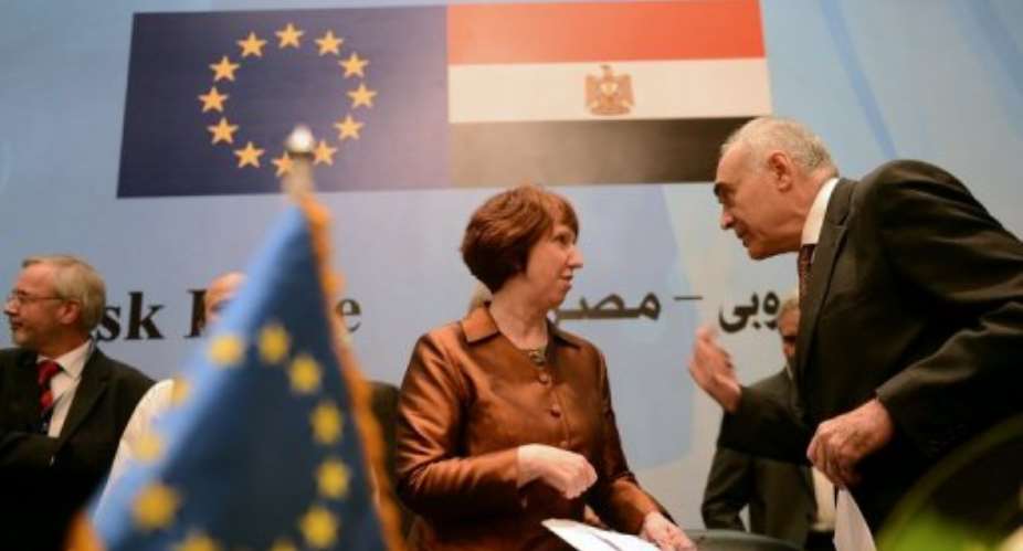 Catherine Ashton of the EU with Egypts Mohamed Kamel Amr at an aid deal signing ceremony in Cairo on November 14, 2012.  By Khaled Desouki (AFP/File)