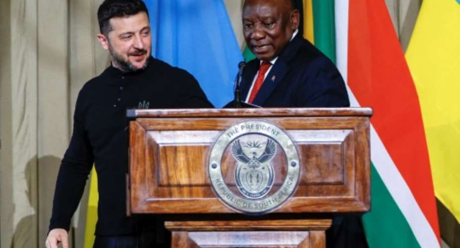 Even while welcoming Zelensky (L) to South Africa, Ramaphosa (R) has maintained warm ties with Russia.  By Phill Magakoe (AFP)