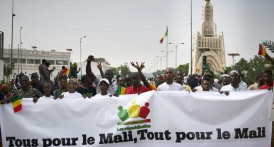 Everyone for Mali, everything for Mali, reads a banner at an opposition-organised rally in the capital Bamako to call for clean presidential elections next month.  By Michele CATTANI AFP