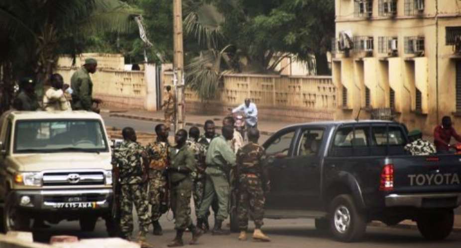 Malian soldiers gather on a street of Bamako.  By Habibou Kouyate AFP