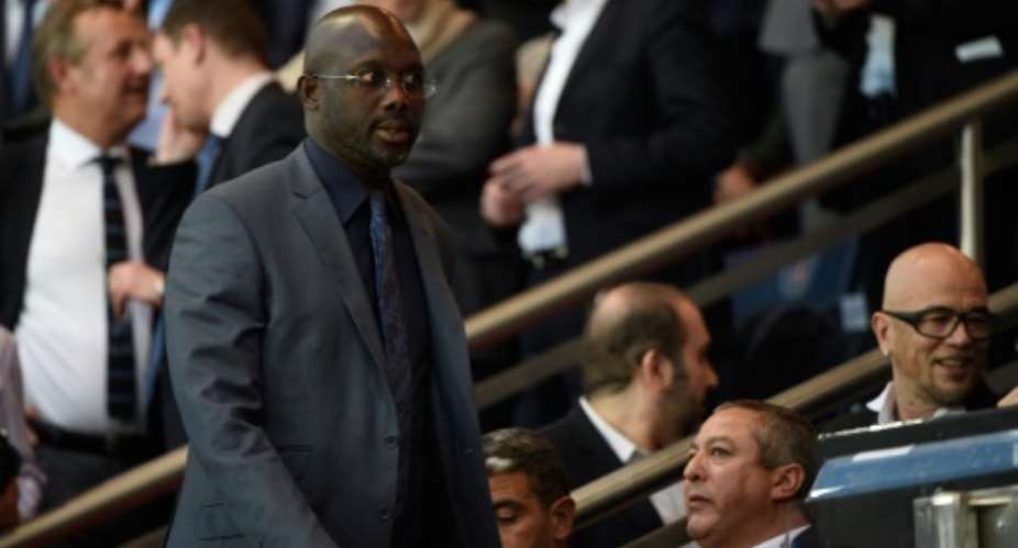 Liberian politician and ex-footballer George Weah attends the UEFA Champions league match PSG vs FC Barcelona in Paris on April 15, 2015.  By Martin Bureau AFPFile