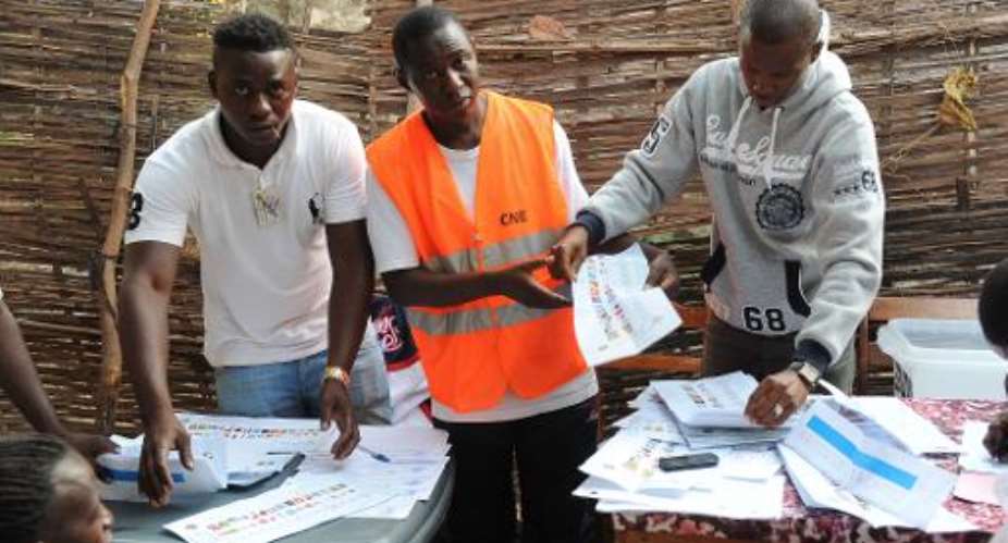 Election officials count ballots at a polling station in Bissau, Guinea-Bissau during national elections on April 13, 2014.  By Seyllou AFPFile