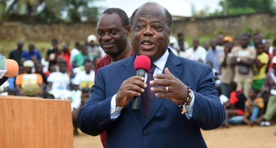 Former Ivoirian Prime Minister and now former candidate for the upcoming presidential election Charles Konan Banny R speaks during a rally on October 10, 2015, for the launch of his campaign at the Dadou stadium in Abidjan.  By Sia Kambou AFPFile