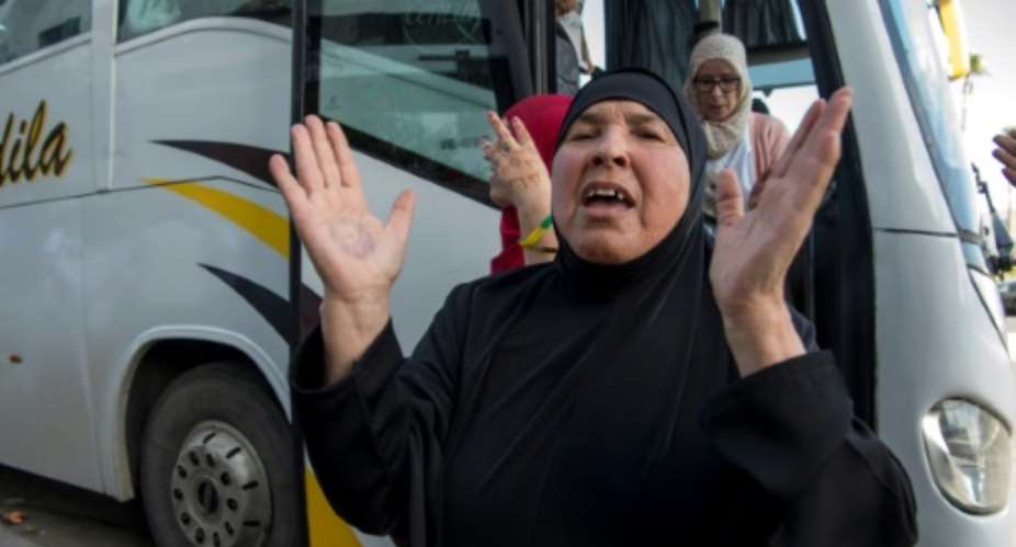 Families of jailed Moroccan protesters emerge from a bus in Casablanca after travelling to see their relatives..  By FADEL SENNA AFP