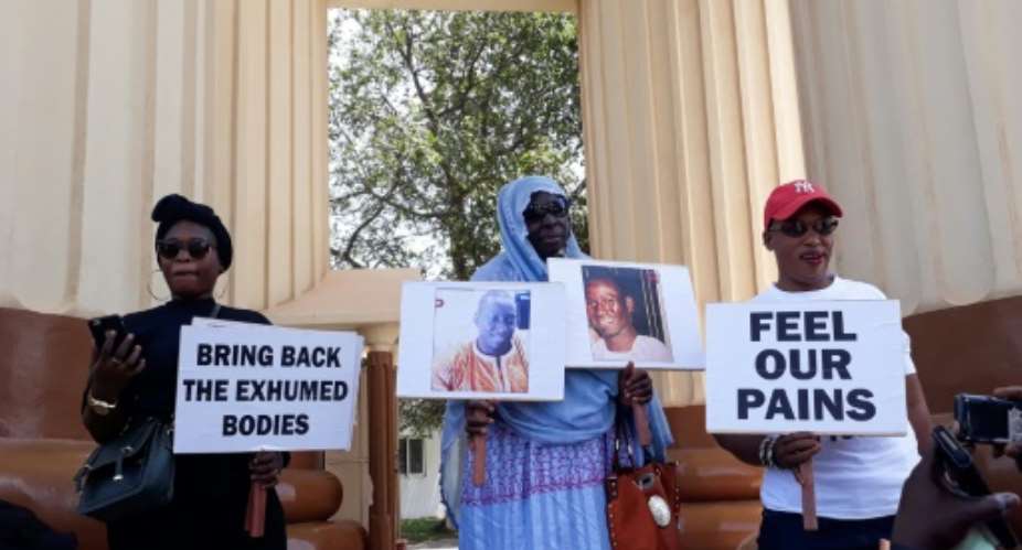 Family members who lost loved ones to repression during Yahya Jammeh's two-decade rule in Gambia hold a protest in April 2018.  By CLAIRE BARGELES AFPFile